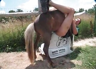 Zoophile stud lets horny horse bang his ass in a missionary position